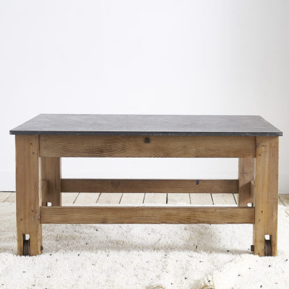 Ancient workshop table with blue stone.