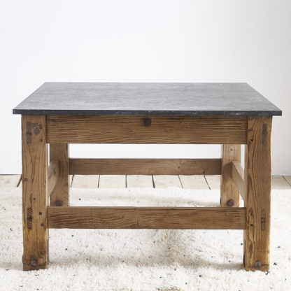 Ancient workshop table with blue stone.