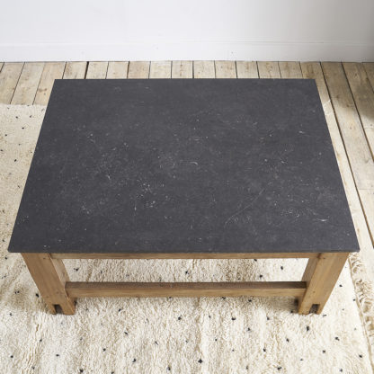 Ancient workshop table with blue stone.