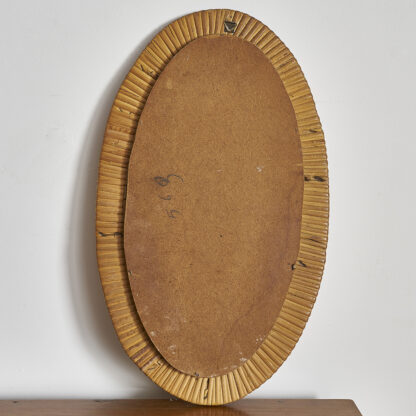 Joli petit miroir ovale en rotin